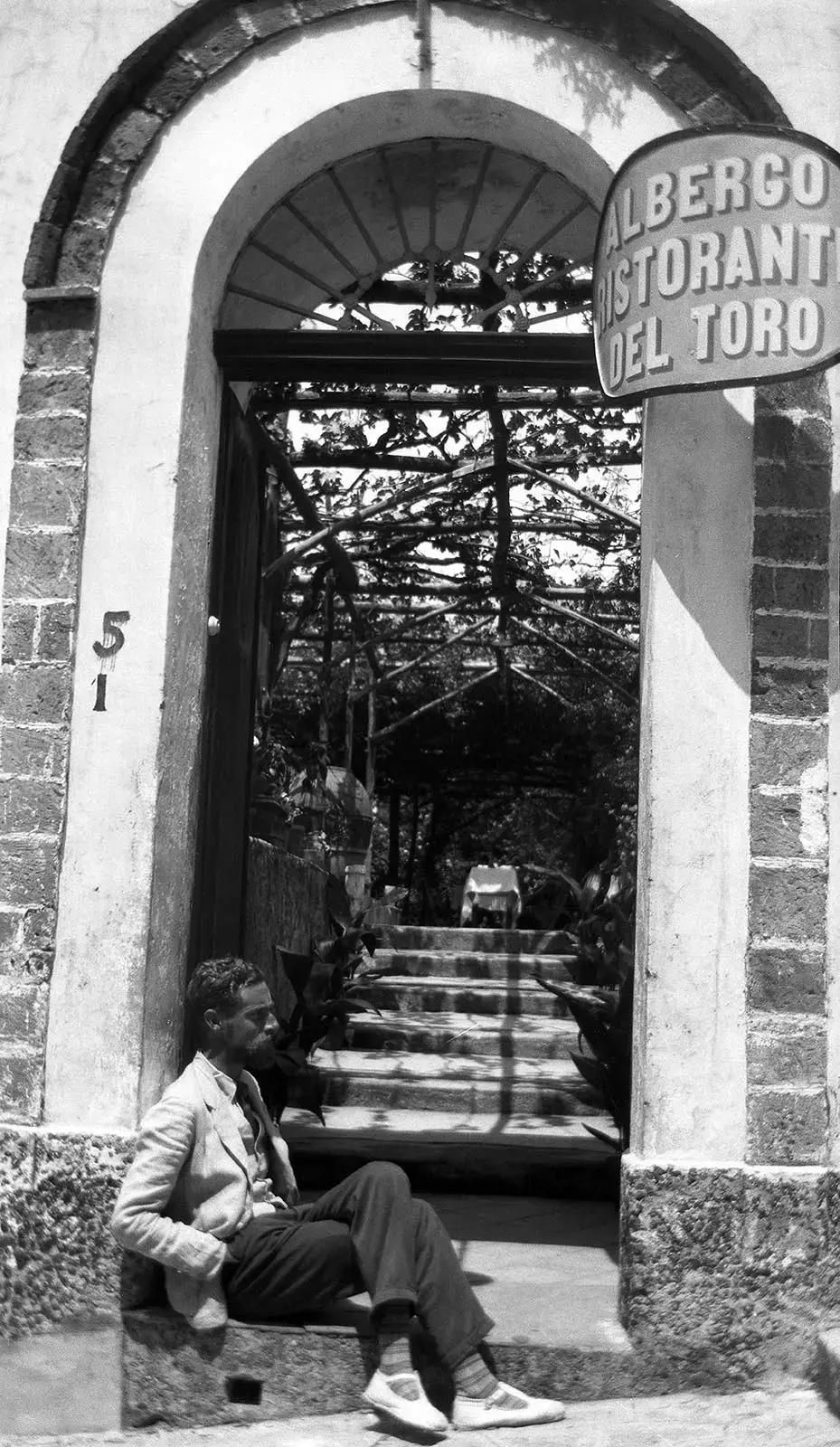 M.C. Escher in front of the Albergo dell Torro, Ravello. Picture taken in 1931